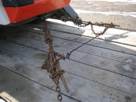 how to chain down a skid steer on a trailer|skidsteer bobcat chain down.